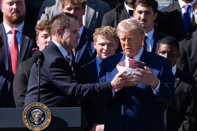 DC: President Trump hosts 2026 National Football Champions Indiana University President Donald Trump is handed a commemorative football by Indiana University football coach Curt Cignetti during an event hosting the 2026 National Football Champions Indiana University on the South Lawn of The White House in Washington D.C., on Monday, May 11, 2026. Washington District of Columbia United States  Copyright: xPool ABACAx