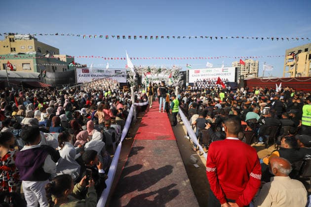 Mass Wedding Gaza City May 11 Guests sit on the sides of a red carpet at the venue of a mass wedding celebration in Gaza City, Gaza Strip, on May 11, 2026. The mass wedding celebration for 50 grooms, identified by organizers as orphans of conflict casualties, is sponsored by the Turkish Humanitarian Relief Foundation (IHH). Gaza Gaza Strip Palestinian Territories Copyright: xAhmedxAlxArinix