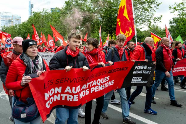 May 12, 2026, Brussels, Brussels, Belgium: For the sixth time since 2025, the three major labour unions have managed to rally their members for a national strike and demonstration. Together with various organisations from different sectors, they have brought 50,000 people onto the streets of Brussels today..The protesters are angry about the reforms of Bart De Weverâ€⠢s federal government. Minister Jan Jambonâ€⠢s pension plans, in particular, are causing a great deal of anger. Various protesters spoke to us: â€oeWe feel robbed.â€Â..The demonstration also passed the American Embassy, where a striking number of people voiced their dissatisfaction with Trump and the US Ambassador to Belgium. ..The offices of the French-speakin - ZUMAr234 20260512_zip_r234_001 Copyright: xBobxReijndersx