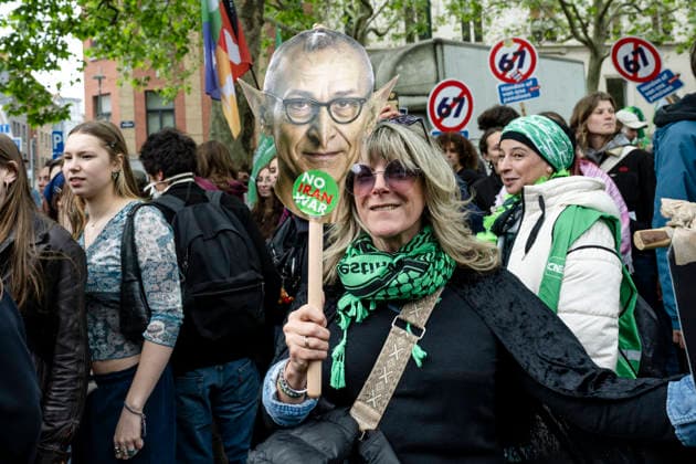 May 12, 2026, Brussels, Brussels, Belgium: For the sixth time since 2025, the three major labour unions have managed to rally their members for a national strike and demonstration. Together with various organisations from different sectors, they have brought 50,000 people onto the streets of Brussels today..The protesters are angry about the reforms of Bart De Weverâ€⠢s federal government. Minister Jan Jambonâ€⠢s pension plans, in particular, are causing a great deal of anger. Various protesters spoke to us: â€oeWe feel robbed.â€Â..The demonstration also passed the American Embassy, where a striking number of people voiced their dissatisfaction with Trump and the US Ambassador to Belgium. ..The offices of the French-speakin - ZUMAr234 20260512_zip_r234_023 Copyright: xBobxReijndersx