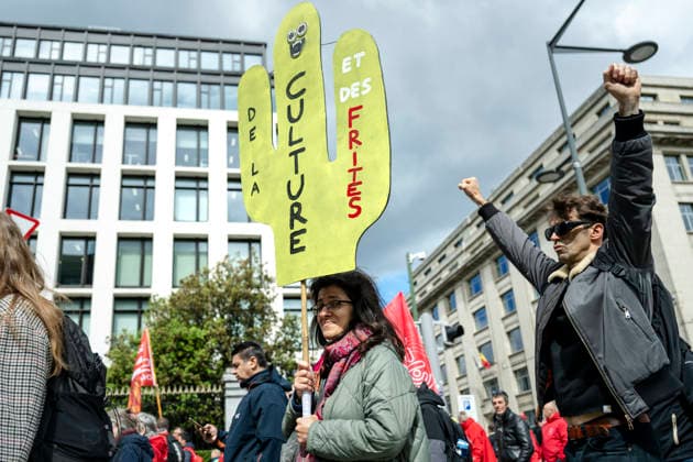 May 12, 2026, Brussels, Brussels, Belgium: For the sixth time since 2025, the three major labour unions have managed to rally their members for a national strike and demonstration. Together with various organisations from different sectors, they have brought 50,000 people onto the streets of Brussels today..The protesters are angry about the reforms of Bart De Weverâ€⠢s federal government. Minister Jan Jambonâ€⠢s pension plans, in particular, are causing a great deal of anger. Various protesters spoke to us: â€oeWe feel robbed.â€Â..The demonstration also passed the American Embassy, where a striking number of people voiced their dissatisfaction with Trump and the US Ambassador to Belgium. ..The offices of the French-speakin - ZUMAr234 20260512_zip_r234_013 Copyright: xBobxReijndersx