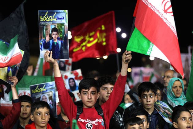 May 12, 2026, Iran, Iran: Pro-government supporters wave national flags during a state-organized rally, amid a ceasefire in the conflict involving Iran, the United States, and Israel. The United States and Israel launched strikes against Iran on February 28, killing Iranâ€⠢s supreme leader and top military leaders, prompting Iranian authorities to retaliate with strikes on Israel and across the Gulf, while U.S. President Donald Trump recently described the ceasefire agreement with Iran as being in a â€oevery weak†state and the spokesman for the Iranian parliamentâ€⠢s national security commission warned the United States on May 10 against any attacks on vessels in Gulf waters, saying Iranâ€⠢s restraint was over. Ira - ZUMAi98_ 20260512_zih_i98_009 Copyright: xIranianxSupremexLeader SxOfficex