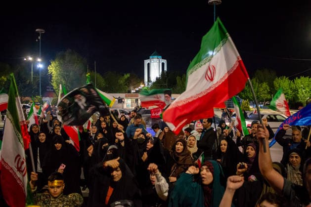 May 12, 2026, Hamedan, Iran: Pro-government supporters wave national flags during a state-organized rally, amid a ceasefire in the conflict involving Iran, the United States, and Israel. The United States and Israel launched strikes against Iran on February 28, killing Iranâ€⠢s supreme leader and top military leaders, prompting Iranian authorities to retaliate with strikes on Israel and across the Gulf, while U.S. President Donald Trump recently described the ceasefire agreement with Iran as being in a â€oevery weak†state and the spokesman for the Iranian parliamentâ€⠢s national security commission warned the United States on May 10 against any attacks on vessels in Gulf waters, saying Iranâ€⠢s restraint was over. - ZUMAi98_ 20260512_zih_i98_011 Copyright: xIranianxSupremexLeader SxOfficex