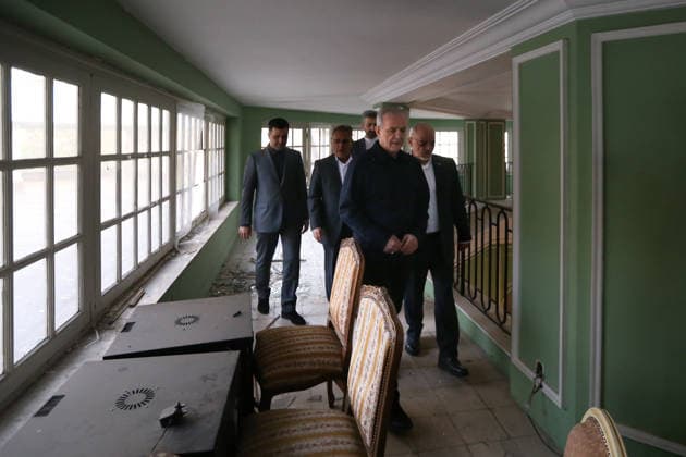 May 12, 2026, Tehran, Iran: Iranian President MASOUD PEZESHKIAN visits the damaged interiors of the Sa dabad Cultural and Historical Complex in Tehran. Since the start of the war, a senior Tehran cultural official said US and Israeli strikes have damaged at least 120 museums and cultural and historic sites nationwide. The Sa dabad Complex is an 80-hectare complex built by the Qajar and Pahlavi monarchs, located in Shemiran, Greater Tehran, Iran. Today, the official residence of the President of Iran is located adjacent to the complex. The complex includes natural forest, streets, qanats, galleries, mansions palaces, and museums. Tehran Iran - ZUMAi98_ 20260512_zih_i98_050 Copyright: xIranianxPresidencyx