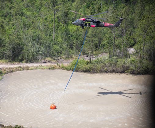 May 12, 2026, Pineland, Ga, United States of America: A U.S. Army UH-60 Black Hawk helicopter with the Georgia Army National Guard, dips a Bambi Bucket into a refill point during the wildfire suppression efforts, April 28, 2026 in Pineland, Georgia. The Pineland Road Wildfire has burned at least 32,000 acres and destroyed over 100 homes across southern Georgia. Pineland United States of America - ZUMAp138 20260512_zaa_p138_047 Copyright: xSgt.xJordanxMcneal UsxArmyx