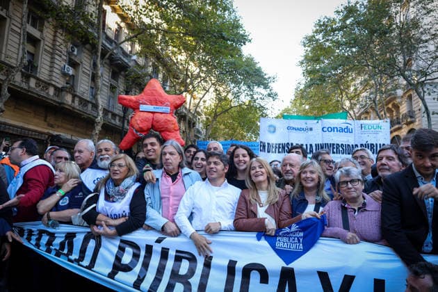 May 12, 2026, Buenos Aires, Buenos Aires, Argentina: Social, political, student and teacher organizations gathered nearby Plaza de Mayo in Buenos Aires, to demand that the Milei government comply with the University Funding Law and restore the salaries of both teaching and non-teaching staff. The underfunding plaguing the education sector is jeopardizing the operation of all national universities. In the center, wearing a white shirt, is Axel Kicillof, the current governor of Buenos Aires. To his right, wearing a brown jacket, is Vero³nica Magario, the vice-governor of the province of Buenos Aires Buenos Aires Argentina - ZUMAa188 20260512_zip_a188_026 Copyright: xPaulaxAcunzox