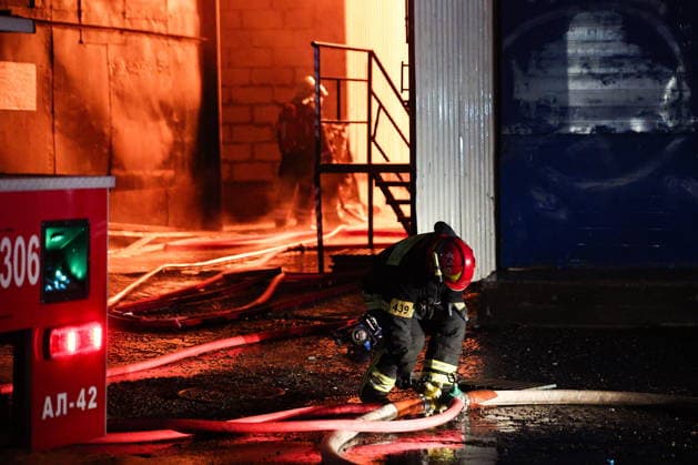 RUSSIA, MOSCOW - MAY 13, 2026: A firefighter battles a fire at the Izmailovo Kremlin. Sofya Sandurskaya TASS  92388772