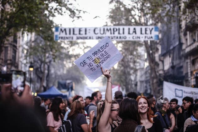 University march in Buenos Aires - 12 May 2026 A protester holds a placard saying Don t let your privilege cloud your humanity. during the rally. Thousands of people participated in a new march in defense of public education and universities. The protesters are demanding the implementation of the teacher funding law that was passed but has not yet been applied. Buenos Aires Argentina Copyright: xRobertoxTuerox xSOPAxImagesx RTUERO_20260512212