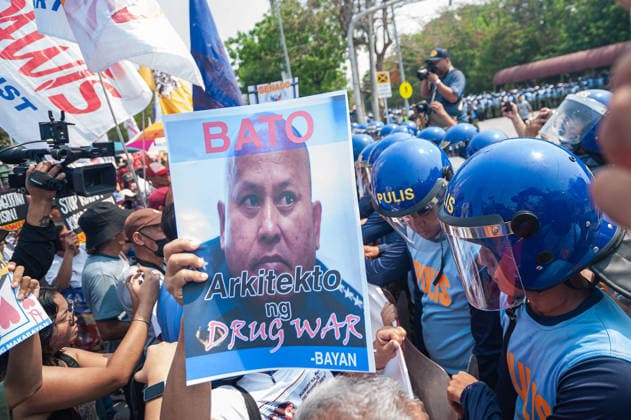 May 13, 2026, Pasay, Metro Manila, Philippines: Protesters stand in front of riot police as they approach the gates of the Philippine Senate. Pasay Philippines - ZUMAy102 20260513_zip_y102_002 Copyright: xKenosisxYapx
