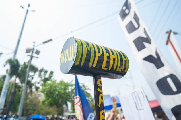 May 13, 2026, Pasay, Metro Manila, Philippines: A protester holds up a makeshift sledgehammer painted with words calling for the impeachment of the vice president. Pasay Philippines - ZUMAy102 20260513_zip_y102_012 Copyright: xKenosisxYapx