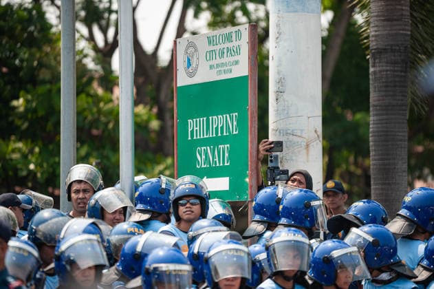 May 13, 2026, Pasay, Metro Manila, Philippines: Hundreds of police officers dresssed in riot gear block the protesters from marching near the senate. Pasay Philippines - ZUMAy102 20260513_zip_y102_018 Copyright: xKenosisxYapx