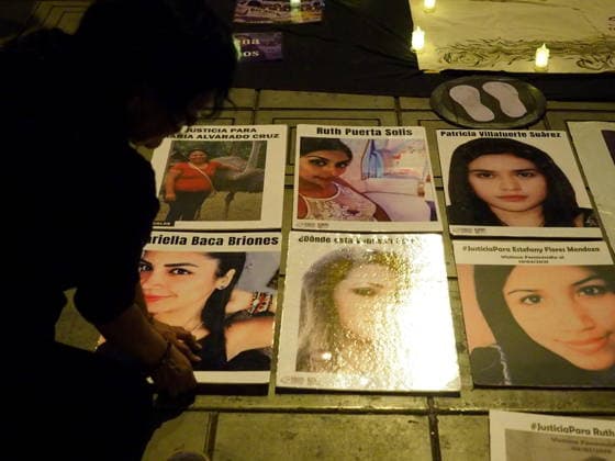 May 12, 2026, Lima, Lima, Peru: Photographs of femicide victims are placed on the floor when a group of women protest in front of the judiciary the serious threat to women s rights posed by recent congressional bills that seek to eliminate in Peru the crime of femicide and also threatens female victims who report violence. Lima Peru - ZUMAg240 20260512_zip_g240_003 Copyright: xCarlosxGarciaxGranthonx