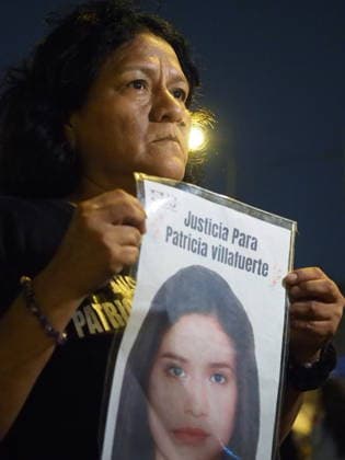 May 12, 2026, Lima, Lima, Peru: Woman carrying photo of a relative who was a victim of femicide when a group of women protest in front of the judiciary the serious threat to women s rights posed by recent congressional bills that seek to eliminate in Peru the crime of femicide and also threatens female victims who report violence. Lima Peru - ZUMAg240 20260512_zip_g240_006 Copyright: xCarlosxGarciaxGranthonx