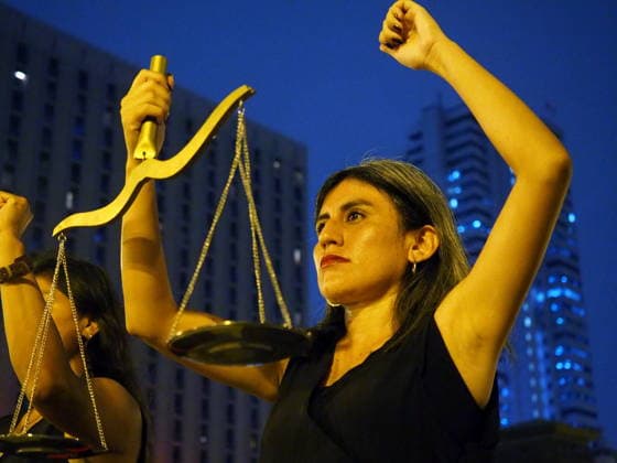 May 12, 2026, Lima, Lima, Peru: Women dressed in black, carrying a scale, and representing justice demonstrating when a group of activists protest in front of the judiciary the serious threat to women s rights posed by recent congressional bills that seek to eliminate in Peru the crime of femicide and also threatens female victims who report violence. Lima Peru - ZUMAg240 20260512_zip_g240_013 Copyright: xCarlosxGarciaxGranthonx