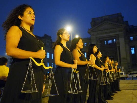 May 12, 2026, Lima, Lima, Peru: Women dressed in black, carrying a scale, and representing justice demonstrating when a group of activists protest in front of the judiciary the serious threat to women s rights posed by recent congressional bills that seek to eliminate in Peru the crime of femicide and also threatens female victims who report violence. Lima Peru - ZUMAg240 20260512_zip_g240_015 Copyright: xCarlosxGarciaxGranthonx