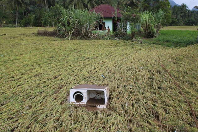 Aftermath of flood in Sumatra TANAH DATAR, INDONESIA - MAY 13: A view of the destruction of rice field among the wooden debris affected by floods in Tanah Datar, West Sumatera Province, Indonesia on May 13, 2026. The structures affected by the floods include residential homes, vehicle, irrigation dam, two village bridge, subdistrict roads, and the rice field. Adi Prima Anadolu Tanah Datar Indonesia. Editorial use only. Please get in touch for any other usage.  Copyright: x2026xAnadoluxAdixPrimax
