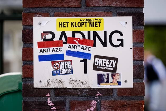 LOOSDRECHT - Stickers against an asylum seekers center on a sign near the emergency shelter for asylum seekers in Loosdrecht. At that building, there was a protest by several hundred people demonstrating against the arrival of asylum seekers at that location. ROBIN VAN LONKHUIJSEN ANP netherlands out - belgium out  Copyright: xx x558145100x originalFilename: 558145100.jpg