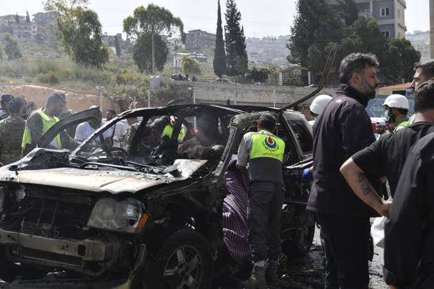 Israeli targets vehicles in Beirut despite the ceasefire BEIRUT, LEBANON - MAY 13: Medical teams, soldiers and civilians arrived at the scene to inspect the area after the Israeli army targeted two vehicles with drones on the coastal road despite the ceasefire in Beirut, Lebanon on May 13, 2026. The vehicles, struck on the Jiyyeh highway, caught fire and were rendered unusable. Houssam Shbaro Anadolu Beirut Lebanon. Editorial use only. Please get in touch for any other usage.  Copyright: x2026xAnadoluxHoussamxShbarox