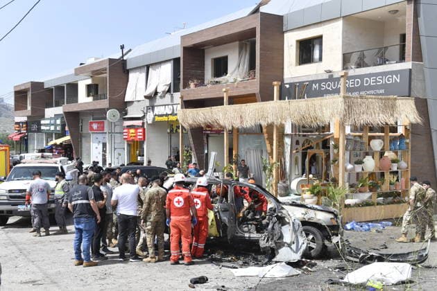 Israeli targets vehicles in Beirut despite the ceasefire BEIRUT, LEBANON - MAY 13: Medical teams, soldiers and civilians arrived at the scene to inspect the area after the Israeli army targeted two vehicles with drones on the coastal road despite the ceasefire in Beirut, Lebanon on May 13, 2026. The vehicles, struck on the Jiyyeh highway, caught fire and were rendered unusable. Houssam Shbaro Anadolu Beirut Lebanon. Editorial use only. Please get in touch for any other usage.  Copyright: x2026xAnadoluxHoussamxShbarox