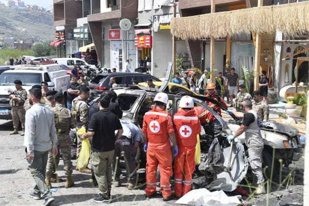 Israeli targets vehicles in Beirut despite the ceasefire BEIRUT, LEBANON - MAY 13: Medical teams, soldiers and civilians arrived at the scene to inspect the area after the Israeli army targeted two vehicles with drones on the coastal road despite the ceasefire in Beirut, Lebanon on May 13, 2026. The vehicles, struck on the Jiyyeh highway, caught fire and were rendered unusable. Houssam Shbaro Anadolu Beirut Lebanon. Editorial use only. Please get in touch for any other usage.  Copyright: x2026xAnadoluxHoussamxShbarox