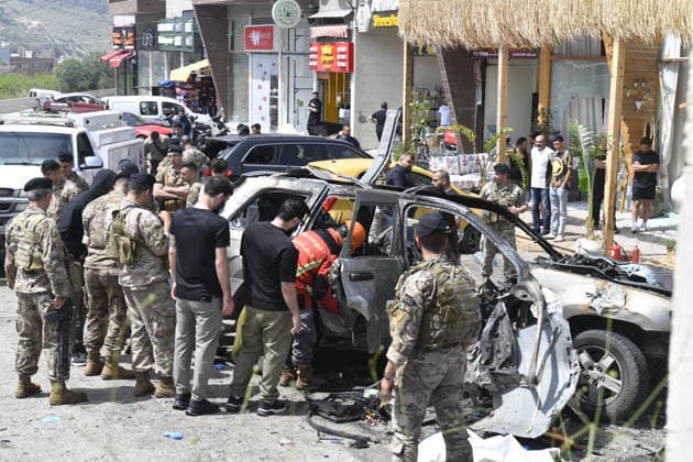 Israeli targets vehicles in Beirut despite the ceasefire BEIRUT, LEBANON - MAY 13: Medical teams, soldiers and civilians arrived at the scene to inspect the area after the Israeli army targeted two vehicles with drones on the coastal road despite the ceasefire in Beirut, Lebanon on May 13, 2026. The vehicles, struck on the Jiyyeh highway, caught fire and were rendered unusable. Houssam Shbaro Anadolu Beirut Lebanon. Editorial use only. Please get in touch for any other usage.  Copyright: x2026xAnadoluxHoussamxShbarox