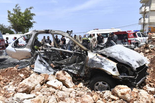 Israeli military carried out a drone strike in Beirut despite ceasefire BEIRUT, LEABANON - MAY 13: A view of burnt car after an Israeli drone strike in Saadiyat, south of Beirut, Lebanon on May 13, 2026. Despite a ceasefire, the Israeli military targeted a total of seven vehicles across different areas of Lebanon since the early hours of the morning using unmanned aerial vehicles (UAVs). In Saadiyat, one of the targeted vehicles was set ablaze and became completely unusable. Firefighters and soldiers arrived at the scene, carried out inspections, and secured the surrounding area. Houssam Shbaro Anadolu Beirut Lebanon. Editorial use only. Please get in touch for any other usage.  Copyright: x2026xAnadoluxHoussamxShbarox