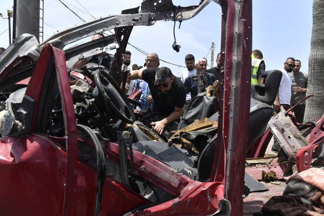 Israeli drone attack target vehicles in Lebanon despite ceasefire SIDON, LEBANON - MAY 13: People inspect the wreckage of a vehicle targeted by an Israeli drone in the city of Sidon, Lebanon on May 13, 2026. Despite a temporary ceasefire brokered on April 17 and recently extended by the United States, the Israeli military intensified its aerial activity, targeting a total of seven vehicles with drone strikes across various Lebanese regions since the early morning hours. Houssam Shbaro Anadolu Sidon Lebanon. Editorial use only. Please get in touch for any other usage.  Copyright: x2026xAnadoluxHoussamxShbarox