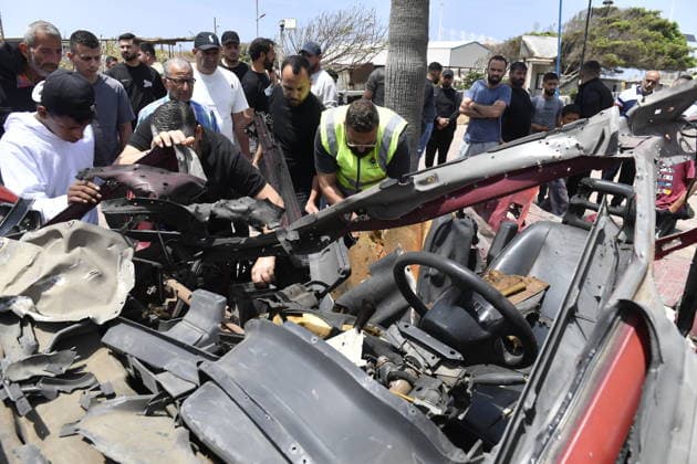 Israeli drone attack target vehicles in Lebanon despite ceasefire SIDON, LEBANON - MAY 13: People inspect the wreckage of a vehicle targeted by an Israeli drone in the city of Sidon, Lebanon on May 13, 2026. Despite a temporary ceasefire brokered on April 17 and recently extended by the United States, the Israeli military intensified its aerial activity, targeting a total of seven vehicles with drone strikes across various Lebanese regions since the early morning hours. Houssam Shbaro Anadolu Sidon Lebanon. Editorial use only. Please get in touch for any other usage.  Copyright: x2026xAnadoluxHoussamxShbarox