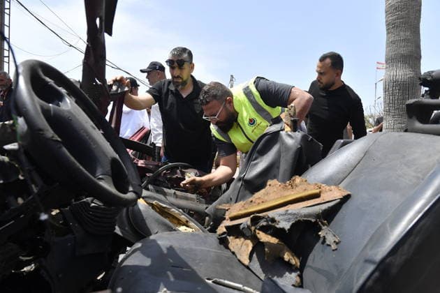 Israeli drone attack target vehicles in Lebanon despite ceasefire SIDON, LEBANON - MAY 13: People inspect the wreckage of a vehicle targeted by an Israeli drone in the city of Sidon, Lebanon on May 13, 2026. Despite a temporary ceasefire brokered on April 17 and recently extended by the United States, the Israeli military intensified its aerial activity, targeting a total of seven vehicles with drone strikes across various Lebanese regions since the early morning hours. Houssam Shbaro Anadolu Sidon Lebanon. Editorial use only. Please get in touch for any other usage.  Copyright: x2026xAnadoluxHoussamxShbarox