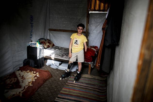 Gaza child who lost limbs in Israeli attacks holds onto life with skating GAZA CITY, GAZA, PALESTINE - MAY 12: Thirteen-year-old Akram al-Fayyumi, who lost his left arm and right foot in an Israeli attack on Gaza, is seen with his skates at his home Gaza City, Gaza, Palestine on May 12, 2026. Akram is holding on to life through his passion for skating and horse riding. Despite using a prosthetic leg fitted in Egypt that he finds uncomfortable, he continues to skate. His only dream is to have a new prosthesis and a horse. Living in the Tel al-Hawa area of Gaza City, Akram says that skating is his greatest source of happiness. Saeed M. M. T. Jaras Anadolu Gaza City Gaza. Editorial use only. Please get in touch for any other usage.  Copyright: x2026xAnadoluxSaeedxM.xM.xT.xJarasx