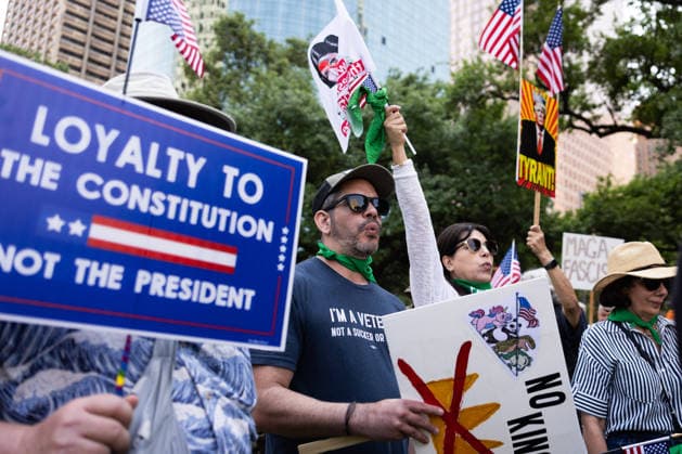 May 13, 2026, Houston, Texas, USA: During a No Kings protest at Houston City Hall in Houston, demonstrators gather holding up signs. Houston USA  - ZUMA 20260513_mda_g287_012 Copyright: xMatthewxGuzmanx