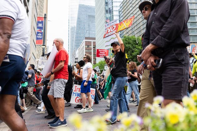 May 13, 2026, Houston, Texas, USA: During a No Kings protest in downtown Houston, demonstrators gather and march through the streets holding up signs. Houston USA - ZUMA 20260513_mda_g287_001 Copyright: xMatthewxGuzmanx