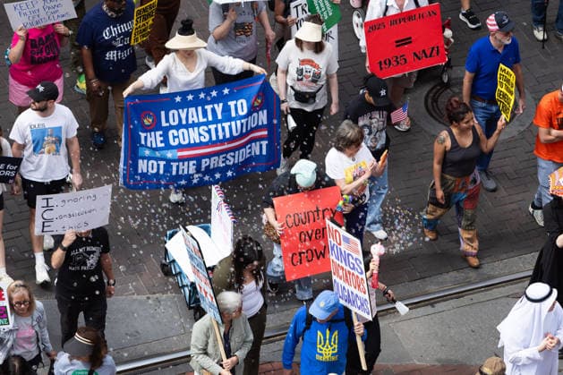 May 13, 2026, Houston, Texas, USA: During a No Kings protest in downtown Houston, gathering demonstrators march and hold up signs. Houston USA - ZUMA 20260513_mda_g287_006 Copyright: xMatthewxGuzmanx