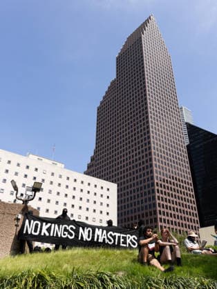 May 13, 2026, Houston, Texas, USA: During a No Kings protest in downtown Houston, demonstrators march holding up signs. Houston USA - ZUMA 20260513_mda_g287_011 Copyright: xMatthewxGuzmanx