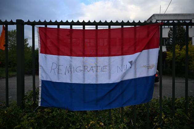 Violent Protest at Asylum Shelter in Loosdrecht LOOSDRECHT, NETHERLANDS - MAY 13: A view of the asylum shelter with a Netherlands flag hung on the barriers as police officers and emergency services respond after a protest outside a temporary asylum shelter turned violent, leading to several arrests after demonstrators reportedly set fires and launched projectiles near the facility in Loosdrecht, Netherlands, on May 13, 2026. Mouneb Taim Anadolu Loosdrecht Netherlands. Editorial use only. Please get in touch for any other usage.  Copyright: x2026xAnadoluxMounebxTaimx