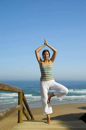 Beautiful young woman doing yoga on the beach model released Symbolfoto Copyright: xIkox Panthermedia68919750.jpg