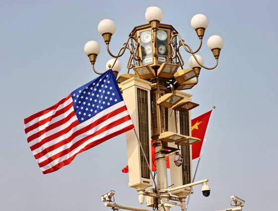 BEIJING, CHINA - MAY 13: National flags of China and the U.S. hang from lamp posts on the Tiananmen Square on May 13, 2026 in Beijing, China. At the invitation of Chinese President Xi Jinping, Trump is visiting China from May 13 to 15.  Copyright: xVCGx 111641168806
