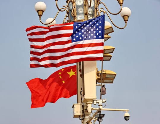 BEIJING, CHINA - MAY 13: National flags of China and the U.S. hang from lamp posts on the Tiananmen Square on May 13, 2026 in Beijing, China. At the invitation of Chinese President Xi Jinping, Trump is visiting China from May 13 to 15.  Copyright: xVCGx 111641168807