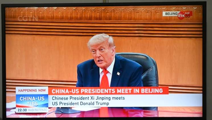 RECORD DATE NOT STATED Trump and Xi Jinping Meeting A TV screen showing a live broadcast of US President Donald Trump, speaking with Chinese President Xi Jinping in a meeting in Beijing, China on May 14, 2026 in Hong Kong. (Photo by Stringer Nexpher Images) Hong Kong