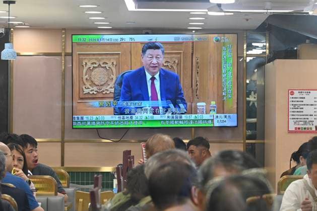 RECORD DATE NOT STATED Trump and Xi Jinping Meeting A TV screen showing a live broadcast of Chinese President Xi Jinping, speaking with US President Donald Trump in a meeting in Beijing, China on May 14, 2026 in Hong Kong. (Photo by Stringer Nexpher Images) Hong Kong