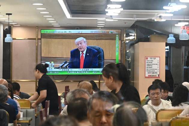 RECORD DATE NOT STATED Trump and Xi Jinping Meeting A TV screen showing a live broadcast of US President Donald Trump, speaking with Chinese President Xi Jinping in a meeting in Beijing, China on May 14, 2026 in Hong Kong. (Photo by Stringer Nexpher Images) Hong Kong