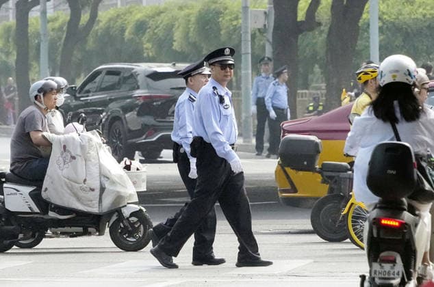 Tightened security in Beijing Security officers patrol in Beijing on May 14, 2026, ahead of a summit between U.S. President Donald Trump and his Chinese counterpart Xi Jinping the same day.  A14AA0005554799P