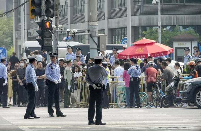 Tightened security in Beijing Security officers patrol in Beijing on May 14, 2026, ahead of a summit between U.S. President Donald Trump and his Chinese counterpart Xi Jinping the same day.  A14AA0005554801P