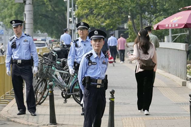Tightened security in Beijing Security officers patrol in Beijing on May 14, 2026, ahead of a summit between U.S. President Donald Trump and his Chinese counterpart Xi Jinping the same day.  A14AA0005554802P