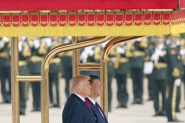 U.S. President Trump in Beijing U.S. President Donald Trump (foreground), alongside Chinese President Xi Jinping, attends a welcoming ceremony at the Great Hall of the People in Beijing on May 14, 2026.  A14AA0005554805P