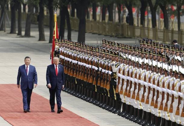 U.S. President Trump in Beijing U.S. President Donald Trump (R), alongside Chinese President Xi Jinping, receives a guard of honor during a welcoming ceremony at the Great Hall of the People in Beijing on May 14, 2026.  A14AA0005554806P