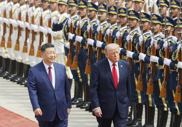 U.S. President Trump in Beijing U.S. President Donald Trump (R), alongside Chinese President Xi Jinping, receives a guard of honor during a welcoming ceremony at the Great Hall of the People in Beijing on May 14, 2026.  A14AA0005554833P