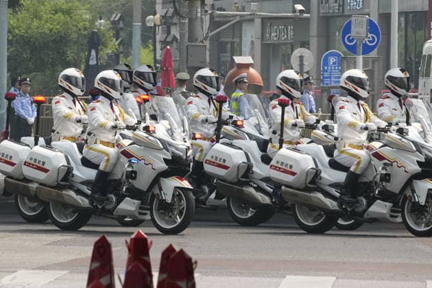 U.S. President Trump in Beijing Police motorcyclists escort the motorcade carrying U.S. President Donald Trump to the Great Hall of the People in Beijing for a summit meeting with his Chinese counterpart Xi Jinping on May 14, 2026.  A14AA0005554838P