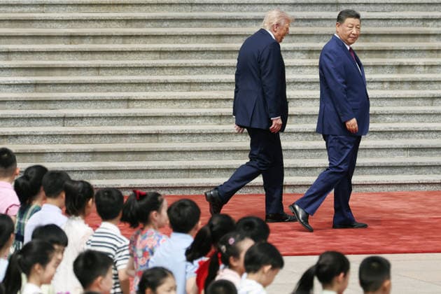 U.S. President Trump in Beijing U.S. President Donald Trump (L), alongside Chinese President Xi Jinping, attends a welcome ceremony at the Great Hall of the People in Beijing on May 14, 2026. (Pool photo)  A14AA0005555070P