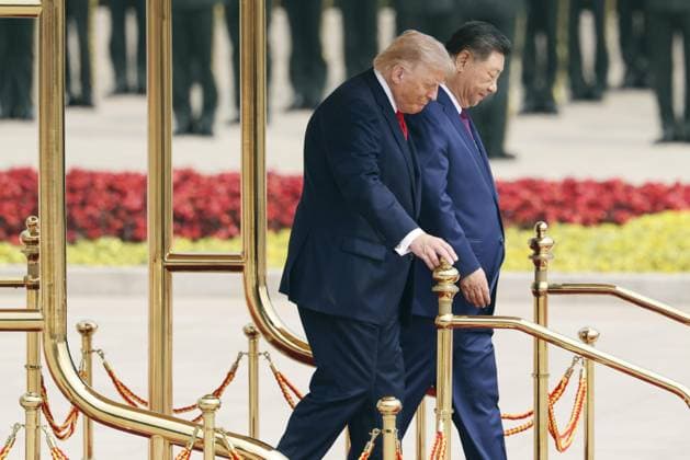 U.S. President Trump in Beijing U.S. President Donald Trump (L), alongside Chinese President Xi Jinping, attends a welcome ceremony at the Great Hall of the People in Beijing on May 14, 2026. (Pool photo)  A14AA0005555071P